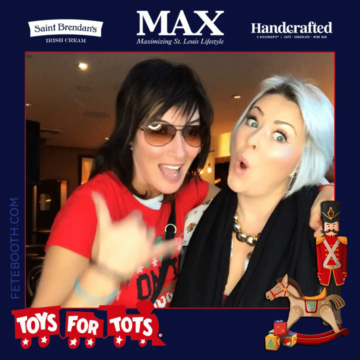 Two friends pose for a Boomerang at a Toys For Tots Event