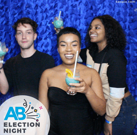Three friends toast in a Keopix Boomerang Booth at the AB Election Night Event 